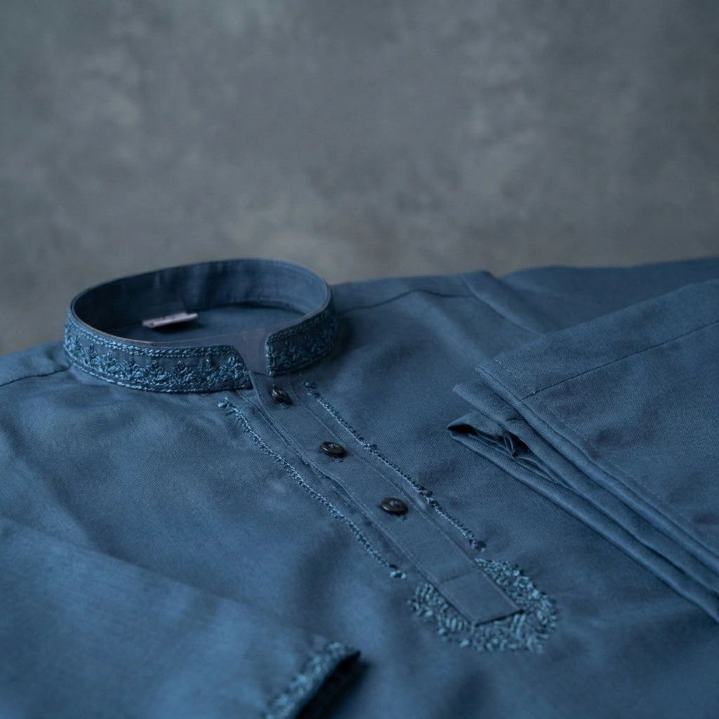 Blue shirt with a collar on a gray background