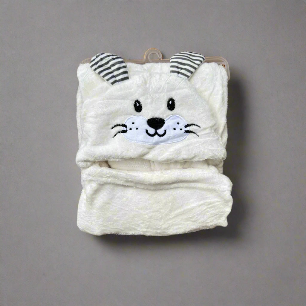 White plush toy with a cat face design on a white background