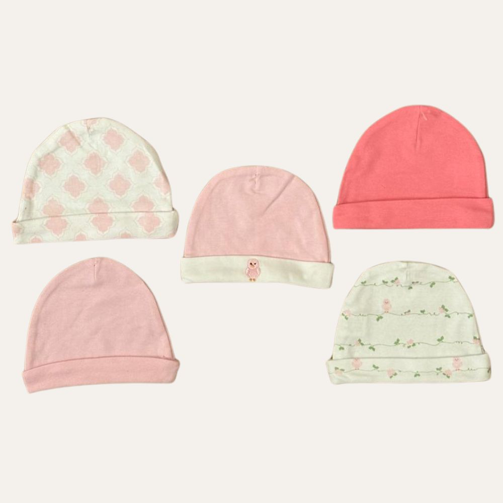 The Baby Girl's 5-Piece Pink Soft Cotton Cap Collection (0-9M) by Alaya Junior features five hats on a light background. Designs include geometric, solid pink, bright pink, small animal motif, and floral pattern on white.