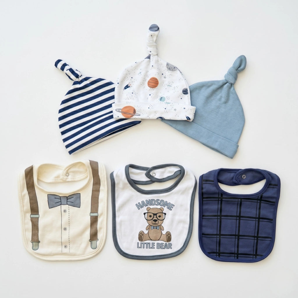 Three baby hats and three bibs on a white background