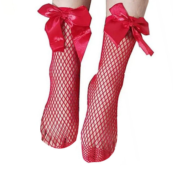 Two feet wearing Big Bow Mesh Socks for Baby Girls, each adorned with a large satin bow near the ankle. The feet are posed with the toes pointing downward and slightly inward, showcasing the intricate mesh pattern and the decorative bows reminiscent of playful designs seen in baby clothing from Pakistan.