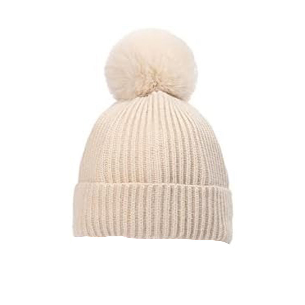 The cream-colored Alaya Junior Hudson Baby Knitted Cap (0-12 Months) features a large fluffy pom-pom, premium knitting, ribbed texture, and a folded brim for a cozy look, perfect for baby clothing in Pakistan.