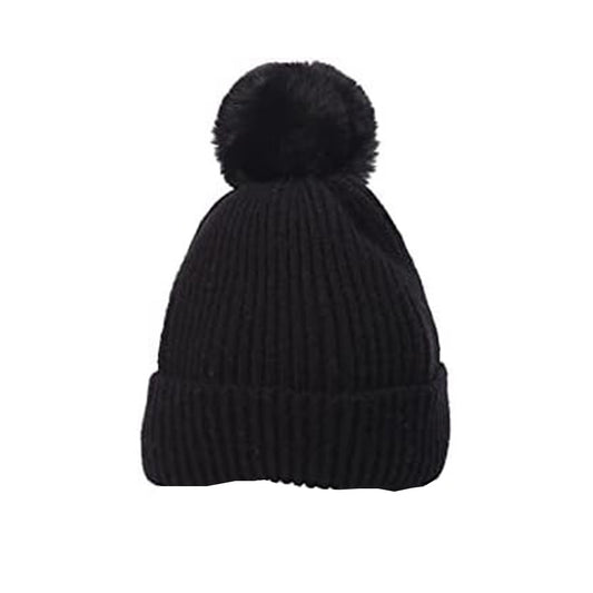 The Hudson Baby Knitted Cap by Alaya Junior, designed for ages 0-12 months, features a ribbed black knit and large pom-pom, showcased against a white background.
