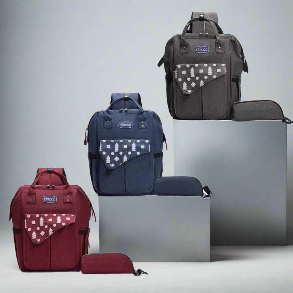Three backpacks in red, blue, and gray with patterned pockets on a white background