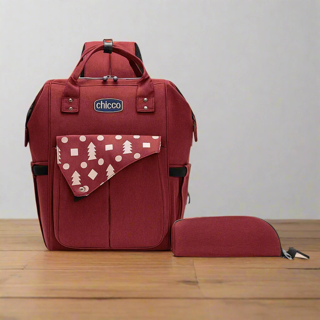 Red backpack with a smaller pouch on a white background, featuring the Chicco brand.