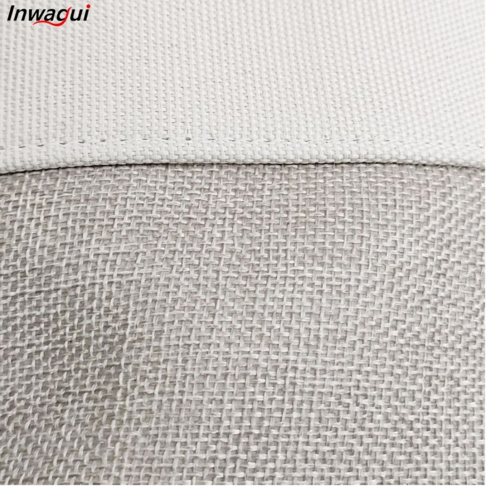 A close-up of textured fabric with a horizontal seam: the top is smooth, and the bottom has a burlap-like texture. This foldable laundry basket from SHEIN features "Inwagui" in the corner, showcasing its cute animal design.