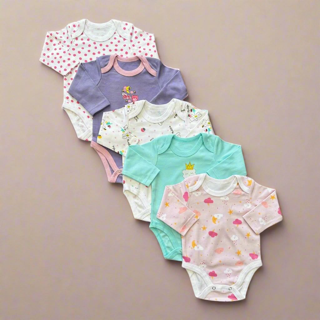 Set of colorful baby bodysuits with various patterns on a white background