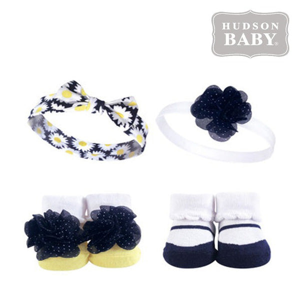 The Alaya Junior Socks Gift Set for baby girls includes two Floral and Polka Dot design headbands with matching socks. The "Hudson Baby" name is prominently featured in the top right corner.