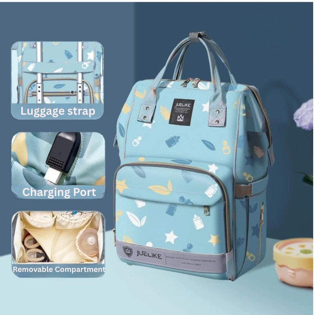 Blue backpack with star and cloud pattern, featuring luggage strap, charging port, and removable compartment on a blue background.