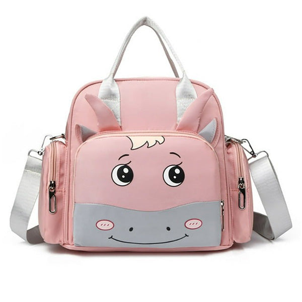 The Alaya Junior Luxury Multi-function Mother Backpack Cartoon Waterproof Diaper Bag is a fashionable and functional accessory for infant clothing in Pakistan. This pink backpack features a cute cartoon animal face with big eyes, a friendly smile on the front, light gray details, and ears that stick out from the top of the bag. It comes equipped with a handle and adjustable shoulder straps for convenience.