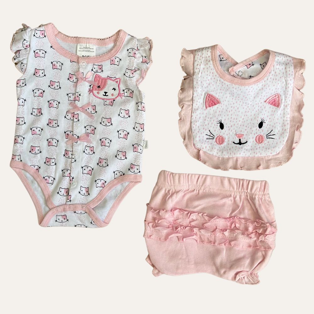 The 3 Pcs Baby Girl Kitten Printed Starter Set by Alaya Junior includes a gray onesie with pink trim and a cat print, a pink bib featuring a smiling cat face with ruffle trim, and pink shorts adorned with ruffle detailing on the back. Perfect for newborns, this adorable set highlights the charm of baby clothing in Pakistan.