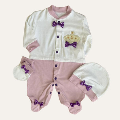 The Charming Trio: MJ Baby Bow Romper Set by Alaya Junior exudes adorable elegance with its pink and white onesie, decorated with purple polka dot bows. Complete the look with a matching hat, mittens, and booties; it's the perfect blend of comfort and fashion for your little trendsetter.