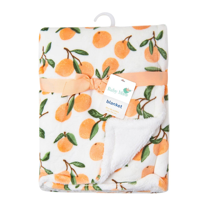 Introducing the Luvable Friends' Citrus Bliss: Unisex Sherpa-Backed Plush Blanket by Alaya Junior, featuring charming orange fruit patterns on a white background. Perfect for newborns, this blanket is folded and secured with an orange ribbon, complete with a tag that reads "Baby Moo blanket." One corner of the blanket is flipped to reveal its soft, fluffy white Sherpa lining—making it an ideal choice for baby clothing in Pakistan.