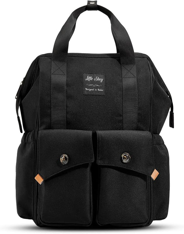 The Ellie & Luke Multifunctional Diaper Bag (Black) by Ellie And Luke features a rectangular design with two front pockets, button closures, and a "Little Story" label. It includes modern elements like insulated bottle holders and top handles, providing ample storage with a sleek look.