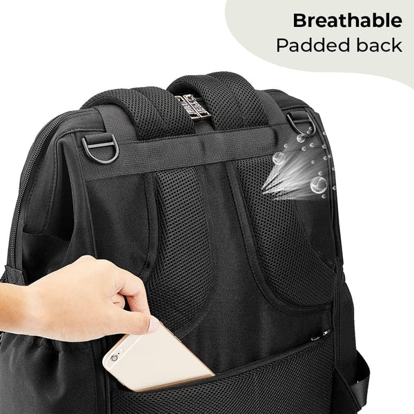 A person slipping a smartphone into the back pocket of an Ellie & Luke Multifunctional Diaper Bag by Ellie And Luke. This sleek black design features breathable, padded straps and back support with visual indicators, including a "Breathable Padded Back" label, ample storage, and insulated bottle holders.