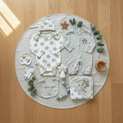 Collection of baby clothing and accessories with star patterns on a white background