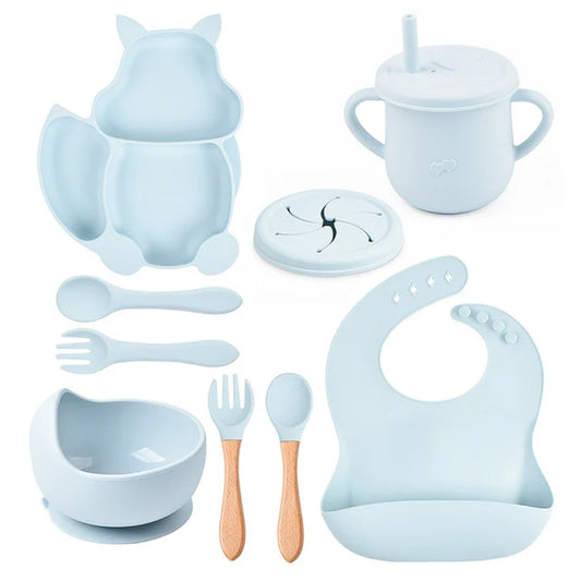 Collection of baby utensils and accessories in light blue on a white background