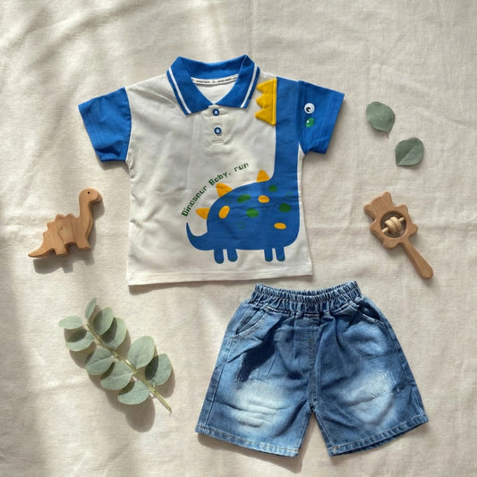 Children's outfit with dinosaur-themed shirt and shorts on a light fabric background