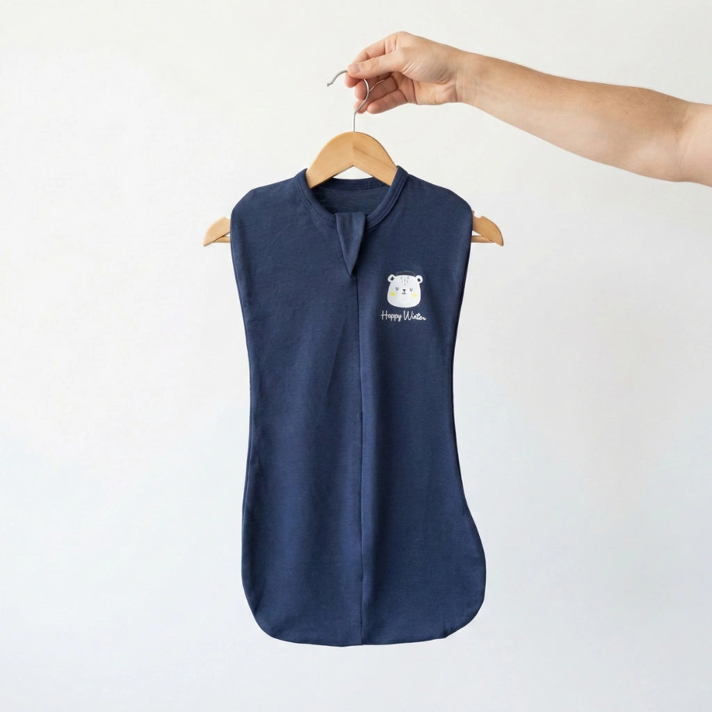 Navy blue sleeveless shirt on a hanger with a white logo against a light background