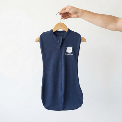 Navy blue sleeveless shirt on a hanger with a white logo against a light background