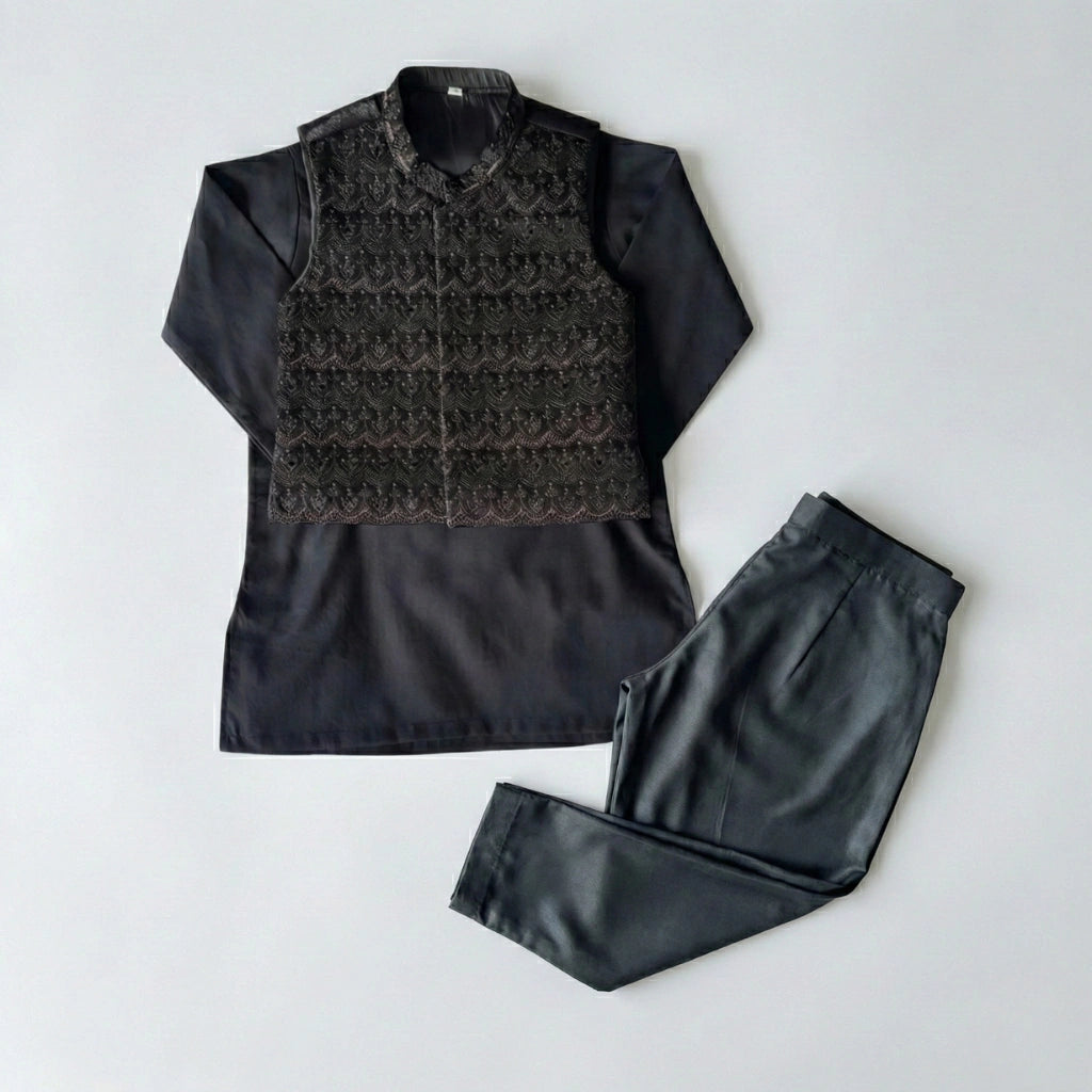 Black shirt with patterned vest and pants on a light gray background