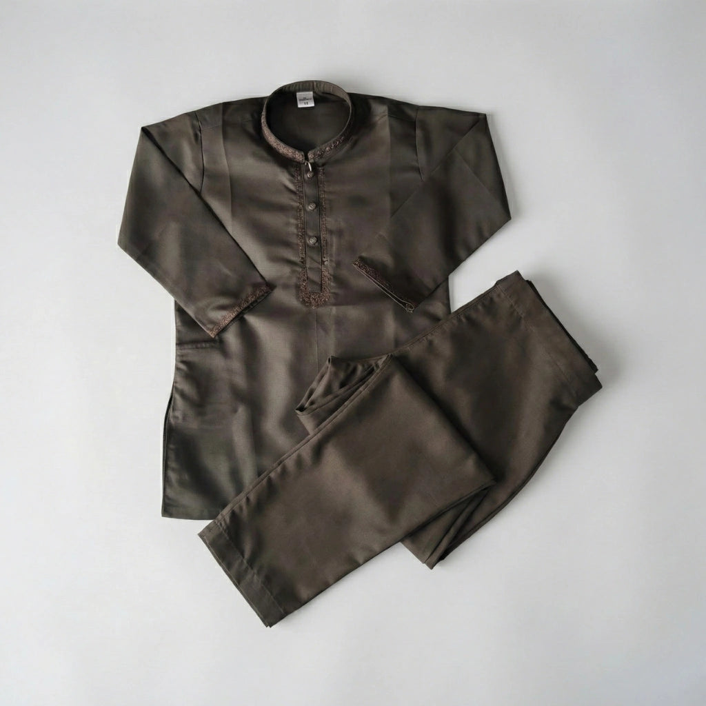 Brown shirt and pants set on a light gray background