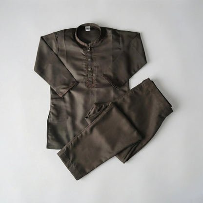 Brown shirt and pants set on a light gray background