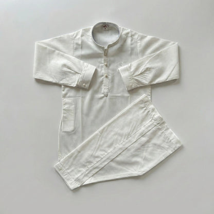 White shirt with rolled-up sleeves on a light gray background