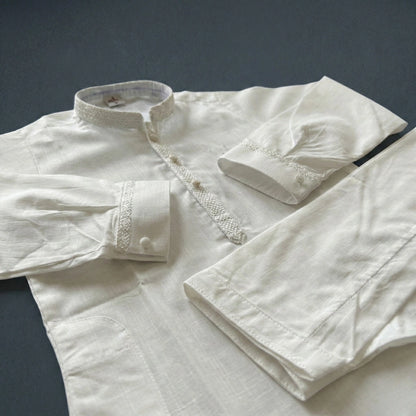 White embroidered shirt on a dark background