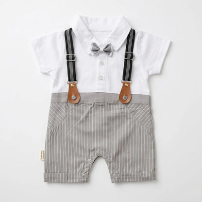 Baby outfit with white shirt, gray striped shorts, suspenders, and bow tie on a white background