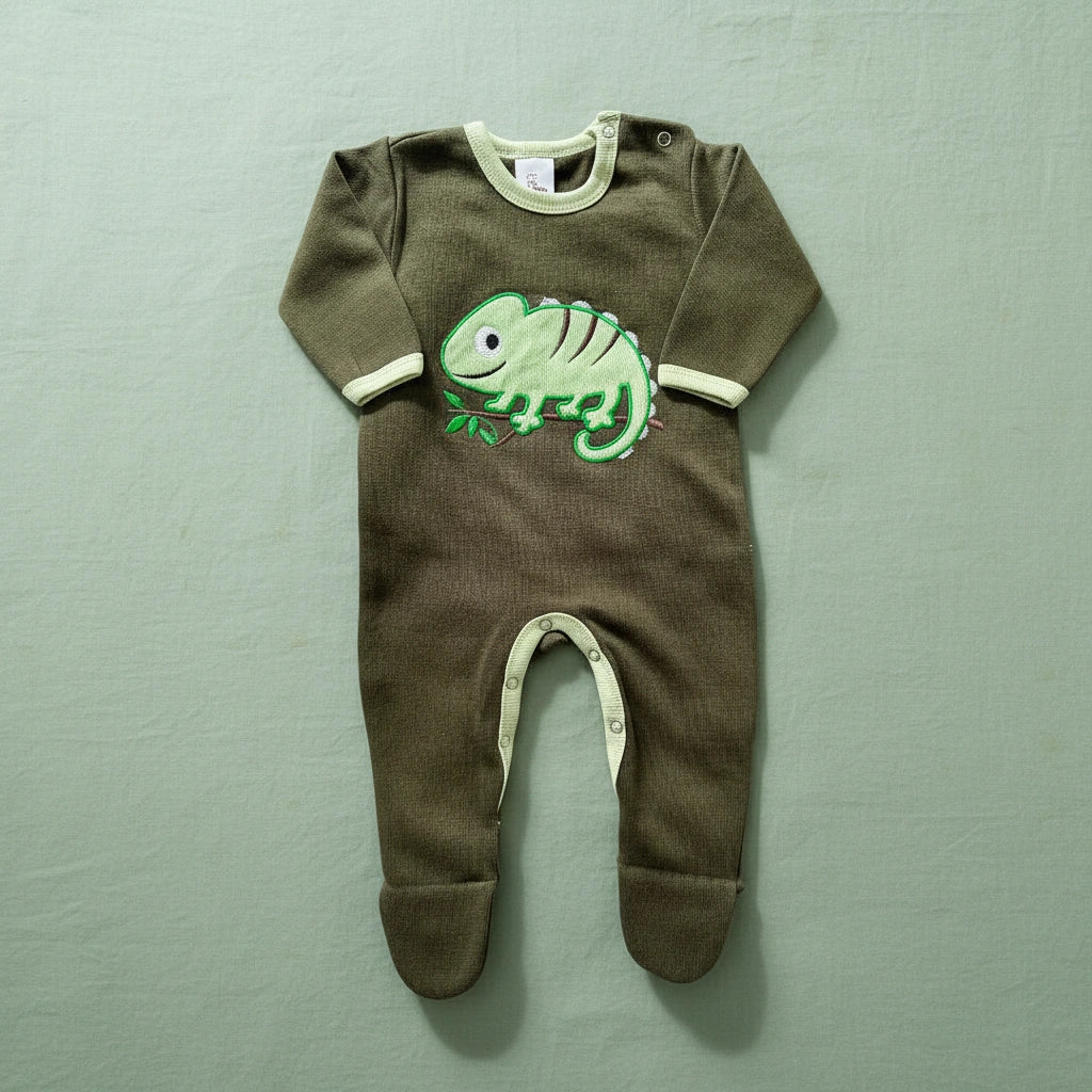 Green baby onesie with a chameleon design on a white background