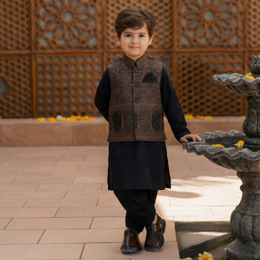 Child in traditional outfit standing next to a decorative fountain with a patterned wall in the background.