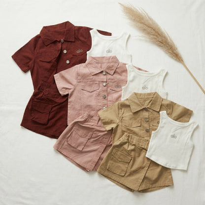 Set of children's shirts in various colors on a white background