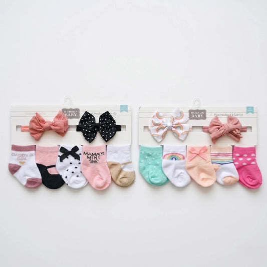 Set of baby socks with decorative bows on a white background