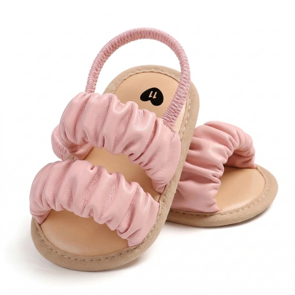 Pink scrunchie sandals on a white background