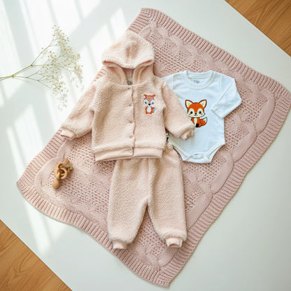 Children's pink fleece set with hood and pants, and a blue onesie with fox design on a white background.