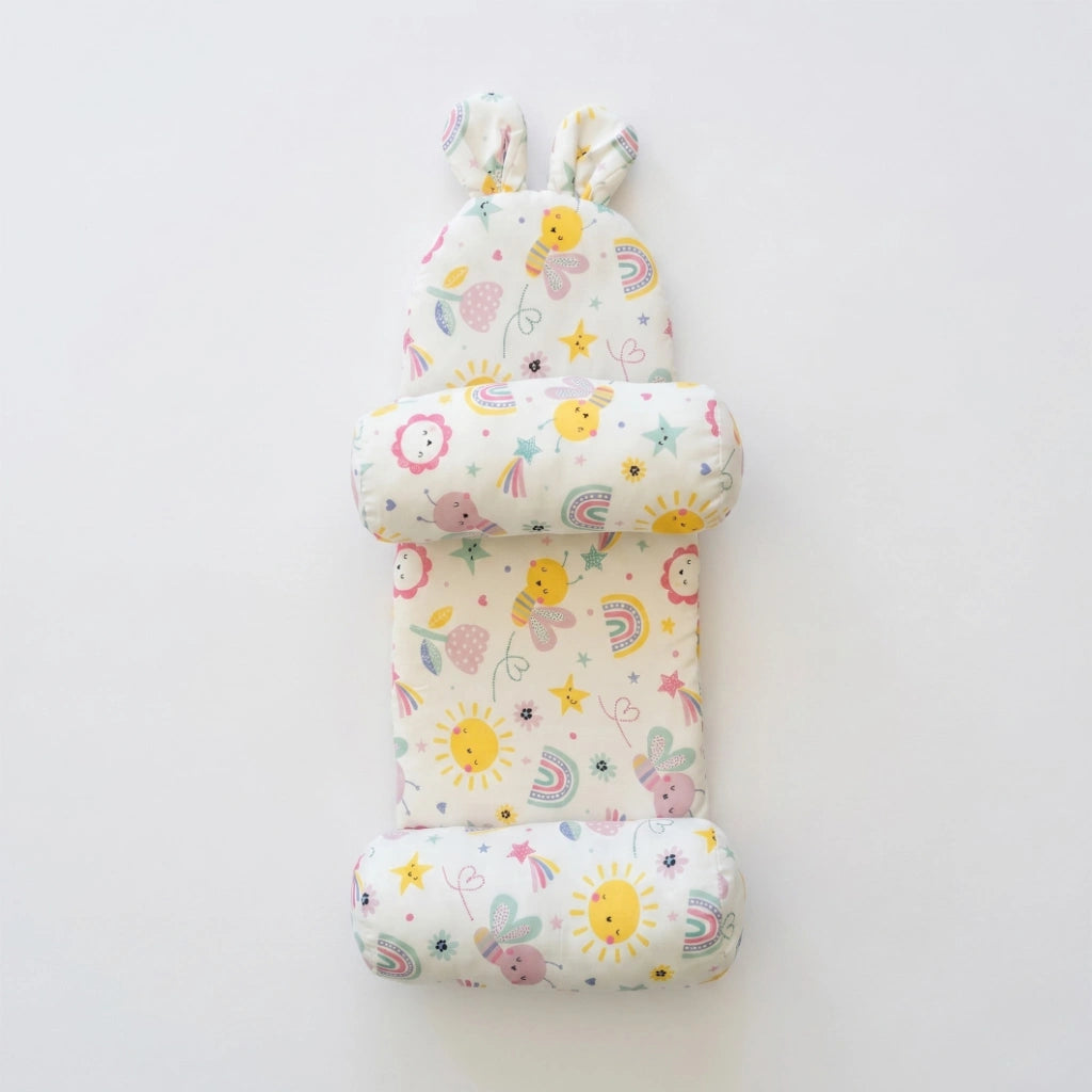 Set of three baby pillows with colorful patterns on a white background
