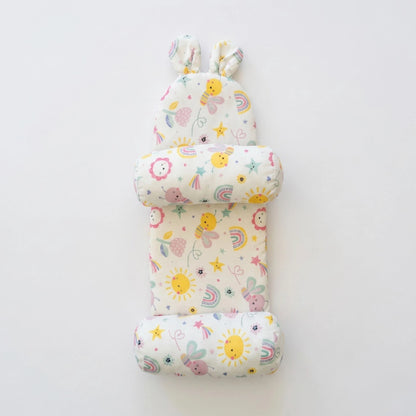 Set of three baby pillows with colorful patterns on a white background