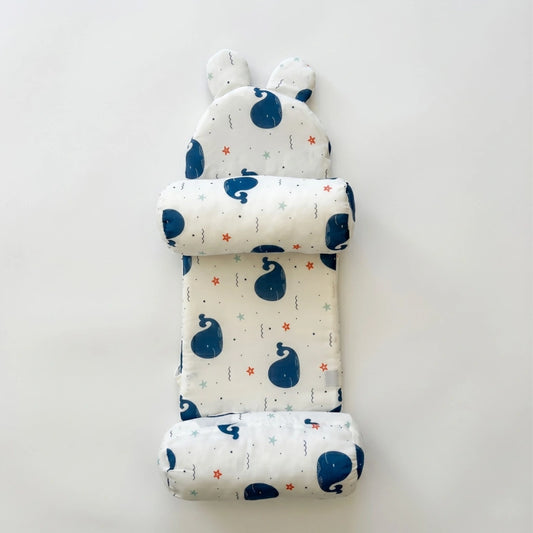 Baby nest with blue whale pattern on a white background