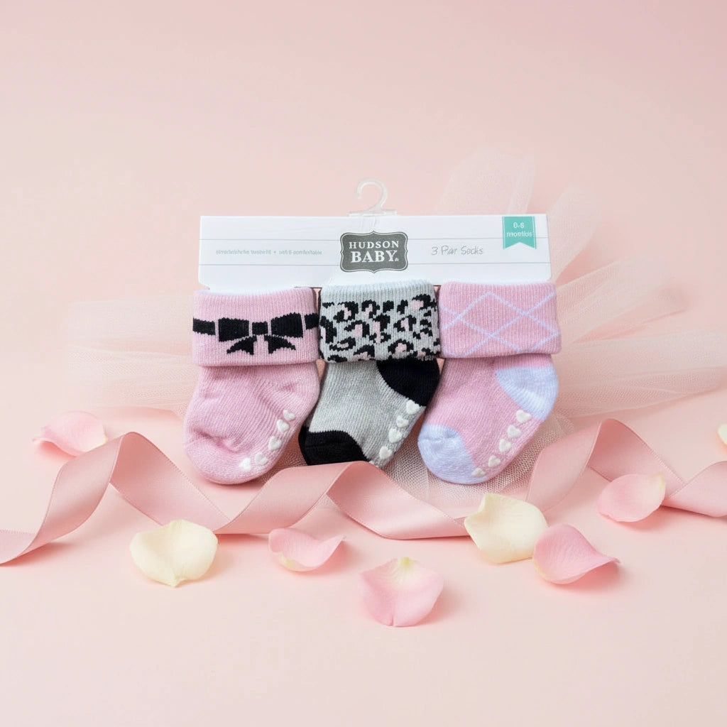 Set of Hudson Baby baby socks on a white background