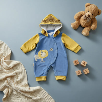 Blue and yellow baby romper with lion design on a white background