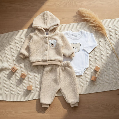 Baby fleece outfit with hoodie, pants, and white shirt with bear design on a white background