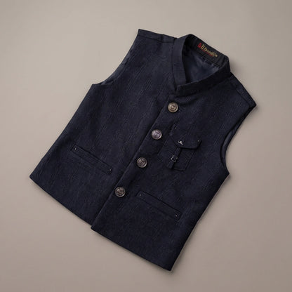 A dark navy blue textured waistcoat vest with a mandarin collar, button closure, and flap pockets, laid flat on a neutral beige background.