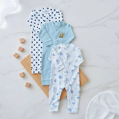 Three baby rompers with different patterns on a white background