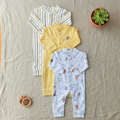 Three baby outfits including a striped shirt, yellow polo shirt, and patterned onesie on a white background.