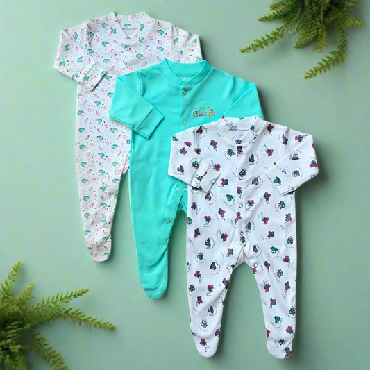 The Carter's Pack Of 3 Baby Girl/Boy Footed Rompers, an aqua-themed collection, showcases one romper with a pastel animal print, another in solid teal adorned with a small embroidered motif, and the third displaying a playful dinosaur design. Made from soft cotton, these rompers are ideal for winter wear with their long sleeves and convenient snap closures.