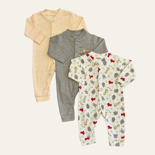 Three baby rompers from the Carters Pack Of 3 Open Feet Romper (Peach & Grey Combination) by Alaya Junior are displayed. The first romper features orange and white stripes, the second is solid gray with a small teddy bear graphic, and the third is white with a colorful animal print including elephants, giraffes, and red bows. Perfect for newborn baby outfits or infant clothing in Pakistan.