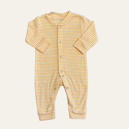 The Carters Pack Of 3 Open Feet Romper (Peach & Grey Combination) by Alaya Junior features long sleeves and a yellow and white striped pattern. It has a full front snap closure from the neckline down to both ankles. The fabric is soft and comfortable, making it perfect for newborn babies. Ideal for those seeking quality infant clothing in Pakistan.