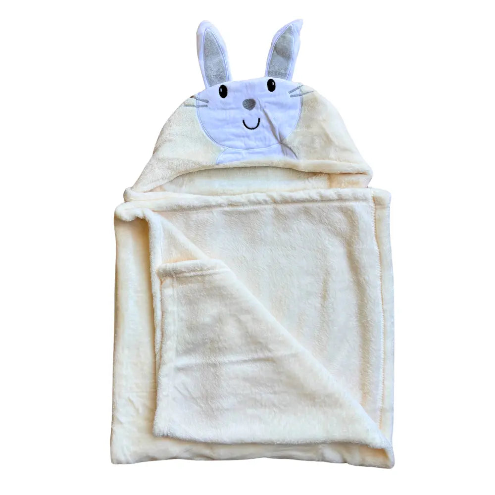 A luxurious, cream-colored baby blanket from Alaya Junior, featuring a character hood design with an embroidered rabbit face and ears. Made from plush material, the Character Hooded Blanket/Wrapping Sheet – Winter (100 x 70 cm) is partially folded to highlight its softness.