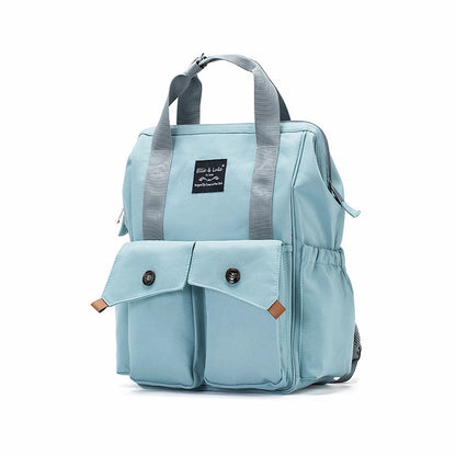 The Ellie & Luke Multifunctional Diaper Bag (Blue) by Ellie And Luke is light blue with gray handles and shoulder straps, featuring two front pockets with button closures and a small black label. Its square shape makes it stylish and unisex, complete with insulated bottle holders.